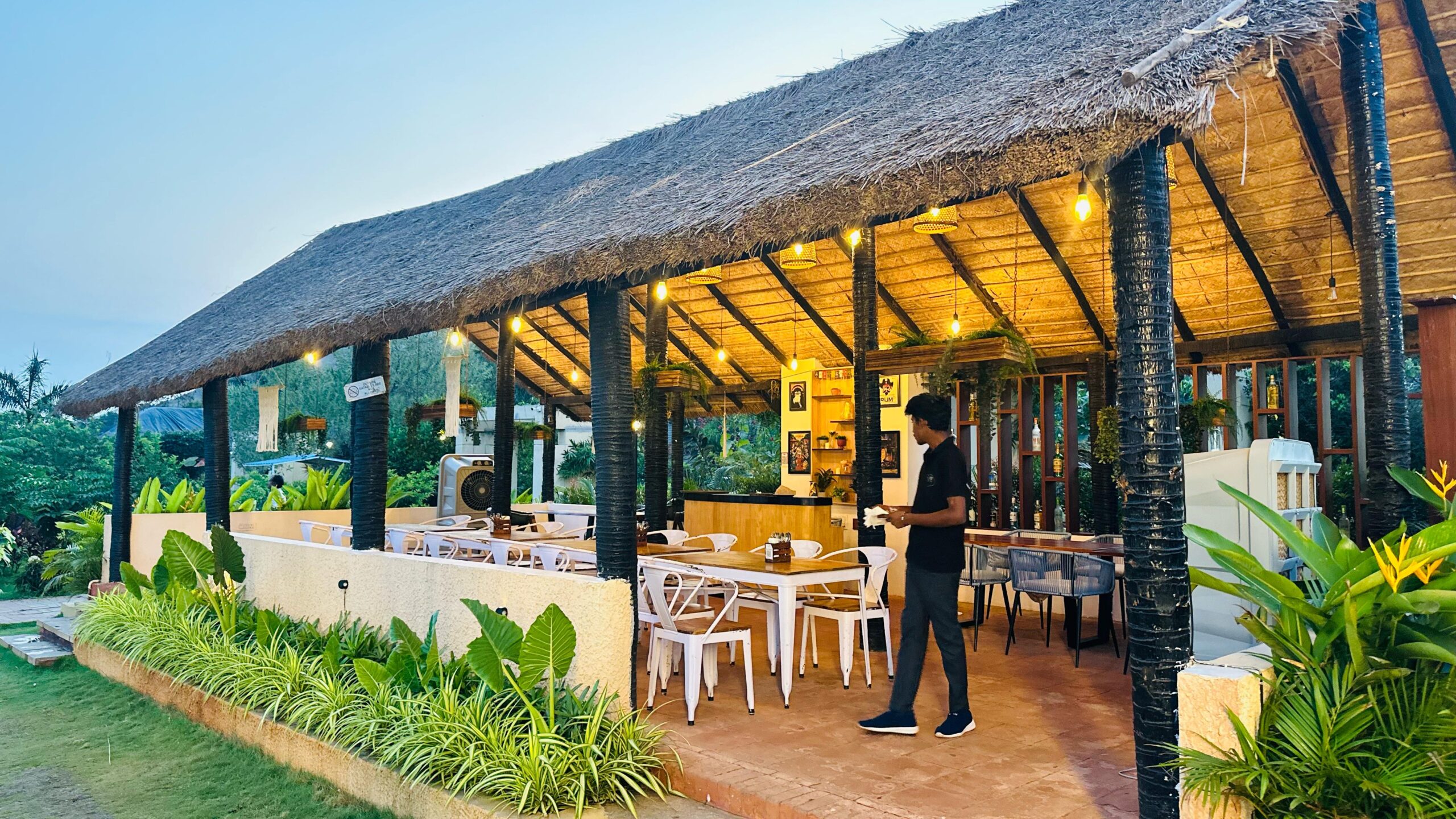 Beachside bar at Sanctum Beach Resort featuring coastal design, relaxed seaside ambiance, and handcrafted cocktails